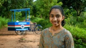Girl with solar powered cart invted by her